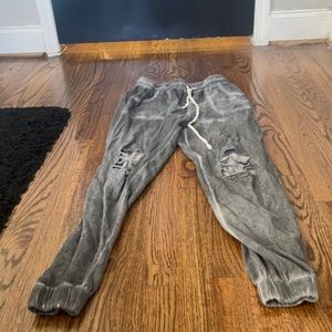 Gray sweat pants with rips